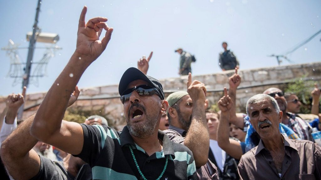 Muslim protesters demonstrate outside the Old City of Jerusalem's Lions Gate on July 19, 2017. (Yonatan Sindel/Flash90)