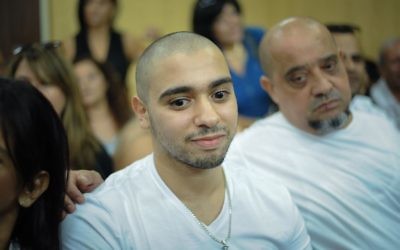 Former IDF Sgt. Elor Azaria, who was convicted of manslaughter for shooting dead a prone, injured, Palestinian attacker in 2015, waits before the start of his appeal sentencing hearing in the Kirya military base, Tel Aviv, July 30, 2017. (Avshalom Sasoni/Flash90) 