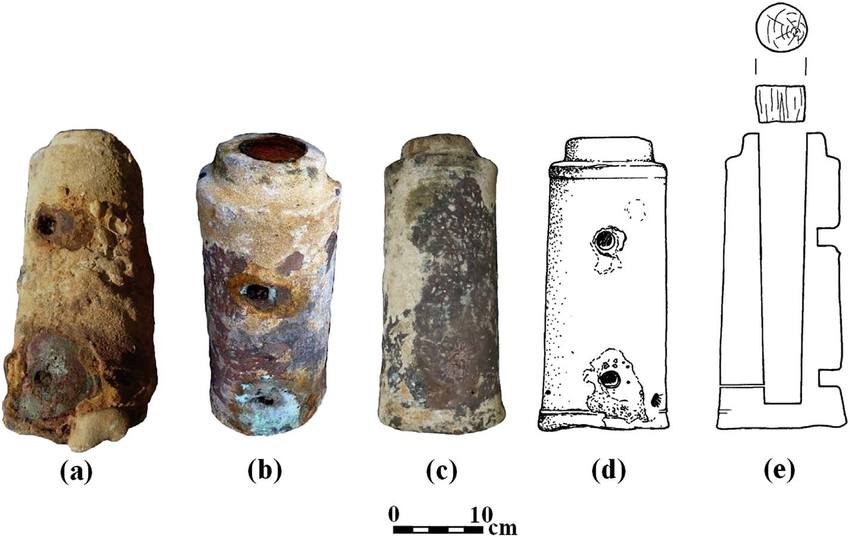 The breach-loading bronze chamber 1: (a) as-retrieved; (b) the chamber after removal of the concretion, with two holes where the iron handle is missing; (c) the chamber after removal of the concretion, far from the missing handle; (d) drawing of chamber 1, area of the missing handle; and (e) cross-section of chamber 1 and its wooden wad (wad 1) (Drawing: R. Pollak, Photos: E. Galili). 
