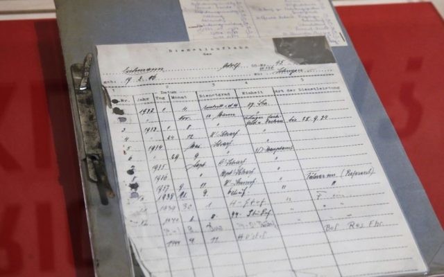 Adolf Eichmann's SS file, obtained by the Israeli Mossad in 1960, is displayed in the "Operation Finale: The Capture & Trial of Adolf Eichmann" exhibit at the Museum of Jewish Heritage, in New York, Friday, July 14, 2017. (AP Photo/Richard Drew)