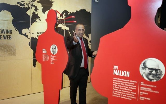 Avner Avraham, former Israeli Mossad agent and curator of "Operation Finale: The Capture & Trial of Adolf Eichmann," stands among silhouette cutouts of the eleven agents who caught Eichmann in Argentina, in the exhibit at the Museum of Jewish Heritage, in New York, Friday, July 14, 2017. (AP Photo/Richard Drew) 