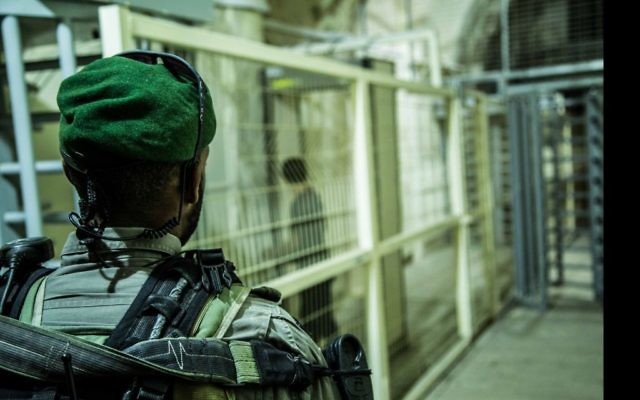Illustrative: A Border Police officer stands guard at a checkpoint in the West Bank city of Hebron. (Israel Police)