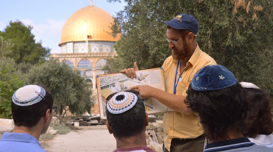  On a tour of the Temple Mount, Yehuda Glick shows religious Jews a diagram of the Jewish temple, which once stood where the golden Dome of the Rock stands today on Sepetember 17, 2013 in Jerusalem Israel. (Photo by Christa Case Bryant/The Christian Science Monitor via Getty Images via JTA)