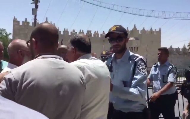 Israeli police prevent Muslims from entering the al-Aqsa compound following a terror attack on July 14, 2017. (Screen capture: Twitter video)