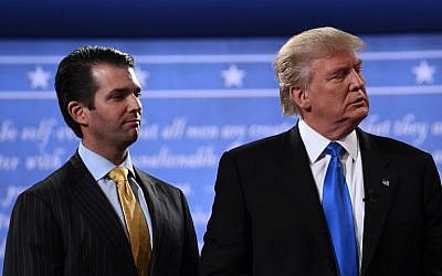 This file photo taken on September 26, 2016, shows former Republican nominee Donald Trump (R) standing with his son Donald Trump Jr. after the first presidential debate at Hofstra University in Hempstead, New York.(AFP PHOTO / Jewel SAMAD)