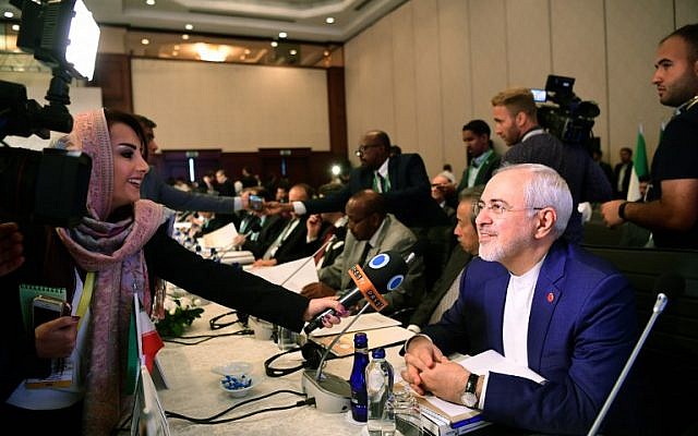 Iranian Foreign Minister Mohammad Javad Zarif, right, speaks to media as he attends the Executive Committee Meeting of Organization of Islamic Cooperation on August 1, 2017 in Istanbul.  (AFP/ OZAN KOSE)