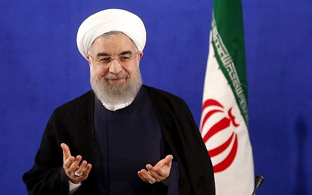 (FILES) This file photo taken on May 22, 2017 shows Iranian President Hassan Rouhani arriving to hold a press conference in Tehran. Rouhani was officially sworn in for a second term on August 3, 2017 at a ceremony overseen by supreme leader Ayatollah Ali Khamanei.  / AFP PHOTO / ATTA KENARE