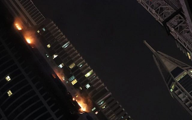 Fire is seen at the 1,105 foot tall Torch tower skyscraper, August 4, 2017 in Dubai. (AFP PHOTO/KARIM SAHIB)