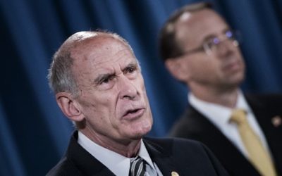 Director of National Intelligence Dan Coats speaks at the Department of Justice on August 4, 2017. (AFP Photo/Brendan Smialowski)