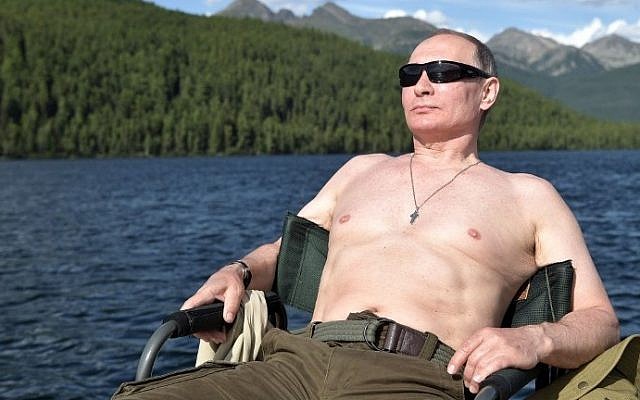 Russian President Vladimir Putin sunbathes during his vacation in the remote Tuva region in southern Siberia. The picture taken between August 1 and 3, 2017. (AFP Photo/Sputnik/Alexey Nikolsky)