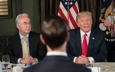US President Donald Trump speaks at a meeting with administration officials, including Health and Human Services Secretary Tom Price (L), on the opioid addiction crisis at the Trump National Golf Club in Bedminster, New Jersey, on August 8, 2017. (AFP PHOTO / NICHOLAS KAMM)