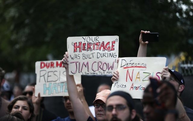 Protesters gather in front of the old Durham County Courthouse where days earlier a confederate statue was toppled by demonstrators, in Durham, North Carolina, on August 18, 2017. (AFP PHOTO / Logan Cyrus)