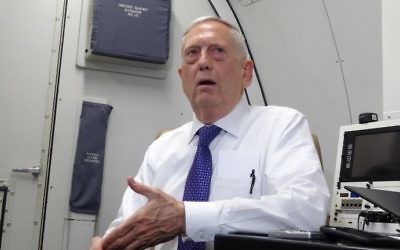 US Defense Secretary James Mattis speaks to reporters on board a flight to Jordan, on August 20, 2017. (AFP Photo/Paul Handley)