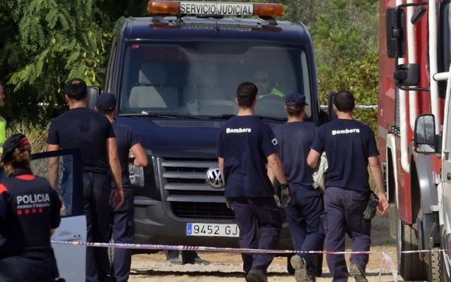 A judicial van carrying bodies leaves the site of an explosion in Alcanar, August 20, 2017. (AFP/JOSE JORDAN)