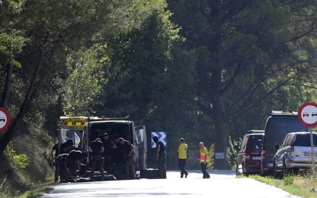 Members of TEDAX-NRBQ on the site where Moroccan suspect Younes Abouyaaqoub was shot on August 21, 2017 near Sant Sadurni d'Anoia, south of Barcelona, four days after the Barcelona and Cambrils attacks that killed 15 people. AFP/LLUIS GENE)