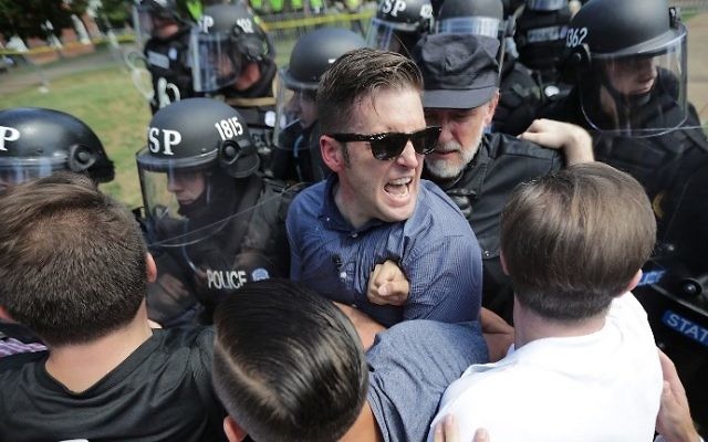 White nationalist Richard Spencer, center, and his supporters clash with Virginia State Police in Lee Park after the 'Unite the Right' rally was declared an unlawful gathering August 12, 2017 in Charlottesville, Virginia. (Chip Somodevilla/Getty Images/AFP)