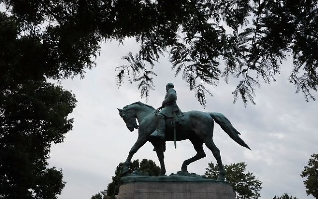 The statue of Confederat Gen. Robert E. Lee stands in the center of Emancipation Park the day after the Unite the Right rally devolved into violence August 13, 2017 in Charlottesville, Virginia. (Chip Somodevilla/Getty Images/AFP)