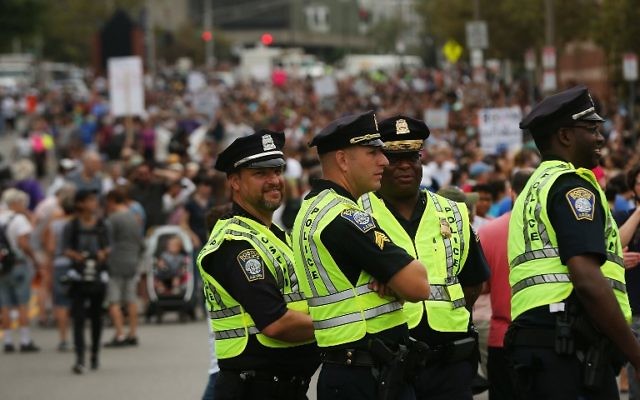  Police stand by as thousands of protesters prepare to march in Boston against a planned 'Free Speech Rally' on August 19, 2017 in Boston, United States. (Spencer Platt/Getty Images/AFP)