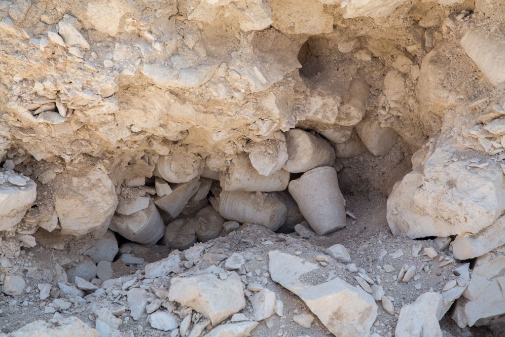 An in situ image of stone vessels unearthed inside the ancient workshop at the stone quarry and tool production center excavations at Reina in Lower Galilee. (Samuel Magal/IAA)