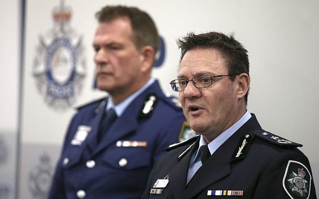 Australian Federal Police Deputy Commissioner Michael Phelan (R) and New South Wales state Police Deputy Commissioner David Hudson discuss details of the charging of two men with terrorism offenses in Sydney, August 4, 2017. (AP Photo/Rick Rycroft)