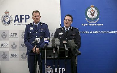 Australian Federal Police Deputy Commissioner Michael Phelan (R) and New South Wales state Police Deputy Commissioner David Hudson discuss details of the charging of two men with terrorism offenses in Sydney, August 4, 2017. (AP Photo/Rick Rycroft)
