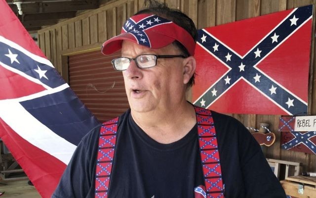Robert Castello, owner of the Dixie General Store, discusses his dislike of neo-Nazis and the Ku Klux Klan in Chulafinee, Ala., on Thursday, Aug. 17, 2017. Castello and other supporters of Southern heritage fear that extremists are hurting their cause with protests like the rally that turned deadly in Charlottesville, Virginia. (AP Photo/Jay Reeves)