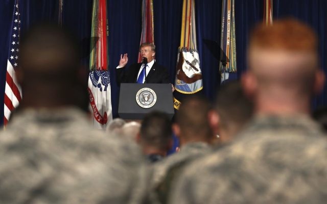US President Donald Trump speaks at Fort Myer in Arlington Virginia, August 21, 2017, during a Presidential Address to the Nation about a strategy he believes will best position the US to eventually declare victory in Afghanistan. (AP Photo/Carolyn Kaster)