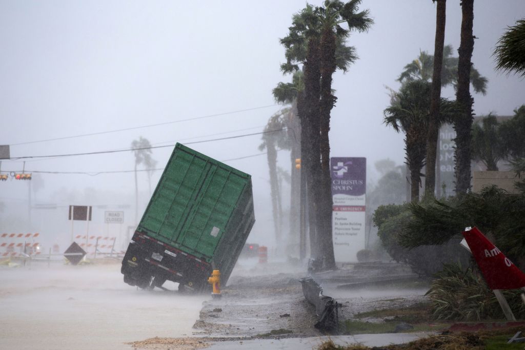 A power generator tips in front of Texas' CHRISTUS Spohn Hospital in Corpus Christi, Texas, as Hurricane Harvey hits Friday, Aug. 25, 2017. (Courtney Sacco /Corpus Christi Caller-Times via AP)