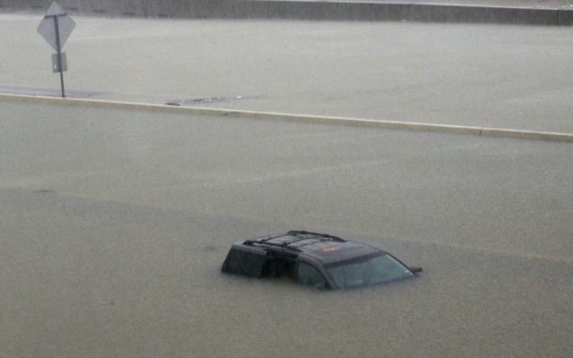 An abandoned vehicle sits in flood waters on the I-10 highway in Houston, Sunday, August 27, 2017. (AP Photo/LM Otero)