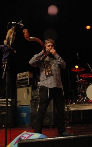 Bram Presser of Yidcore blowing a shofar onstage in Melbourne, Australia. (Ben Gunzberg/via JTA)