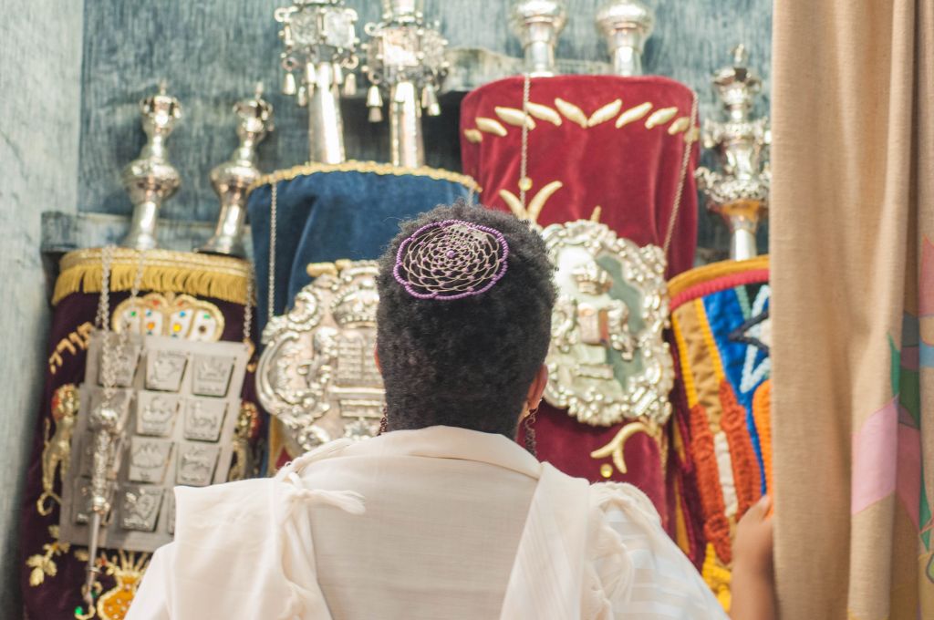 Rabbi Tiferet Berenbaum in front of the holy ark. (Courtesy)