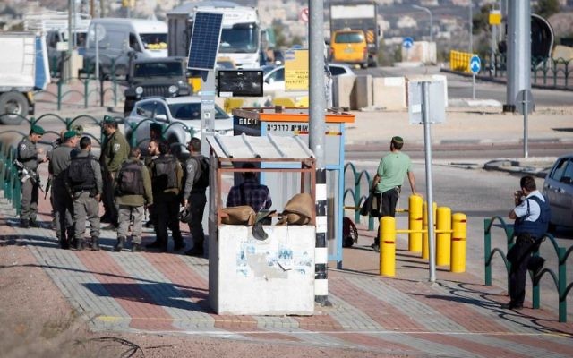 Illustrative: Israeli soldiers secure the scene after a Palestinian assailant attempting to stab Israeli guards at a junction near the West Bank city of Nablus, was shot and killed by Israeli soldiers on December 8, 2016.(Nasser Ishtayeh/Flash90)