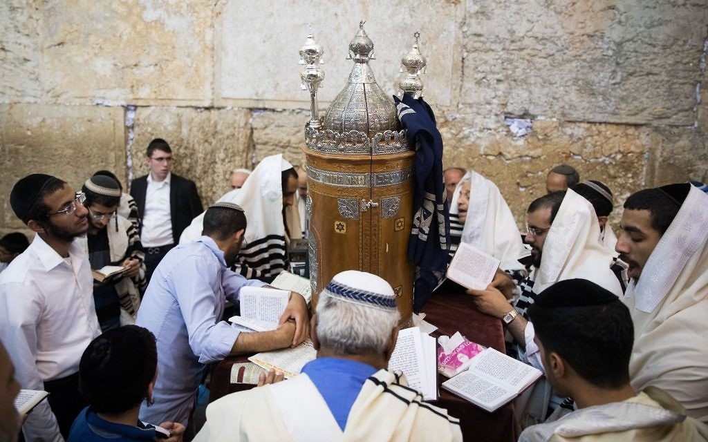 Jewish men pray during the holiday of Tisha B'Av at the Western Wall in the Old City of Jerusalem, on August 1, 2017. (Yonatan Sindel/Flash90)