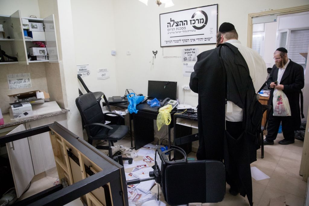 An ultra-Orthodox man seen in an anti-draft office in the Mea Shearim neighborhood after a police raid, on August 8, 2017. (Yonatan Sindel/Flash90)