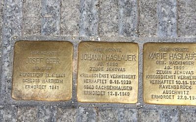 Illustrative: Three Stolpersteine, or 'stumbling stones,' dedicated to the memory of Josef Geer and to the Hauslauers -- a married couple who were Jehovah's Witnesses -- in Salzburg, Austria. (Noah Lederman/Times of Israel)