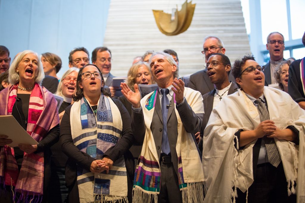 Interfaith leaders gather at Boston's Temple Israel on August 17, 2017, for a vigil against bigotry and racism (Elan Kawesch/The Times of Israel)