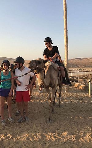 Actor Jonathan Lipnicki rides a camel during his Birthright trip on July 31, 2017. (courtesy Jonathan Lipnicki)