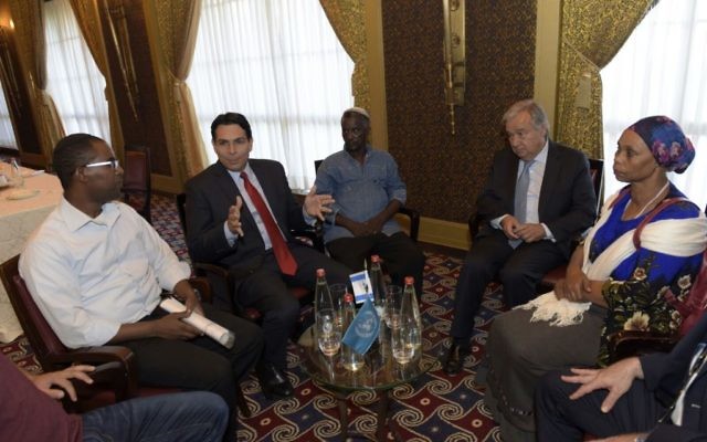 United Nations Secretary General Antonio Guterres (2r) and Israel's ambassador to the UN Danny Danon (2l) meet with the families of Oron Shaul, Avraham Abera Mengistu and Hisham al-Sayed, who are being held by Hamas in the Gaza Strip on August 28, 2017. (Shlomi Amsalem).