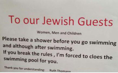 A sign put up at a Swiss hotel calling on Jewish guests to shower before going swimming (Courtesy)