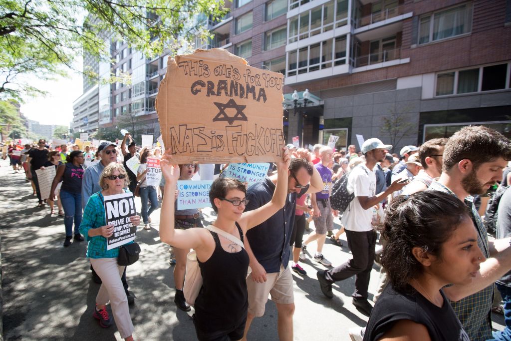 A protester at a rally against bigotry in Boston on August 18, 2017 (Elan Kawesch/The Times of Israel)