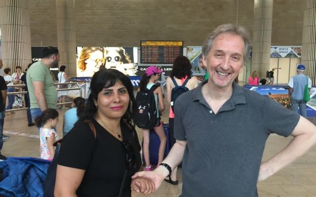 Neda Amin is welcomed by Times of Israel's David Horovitz at Ben-Gurion Airport, August 10, 2017 (Times of Israel staff)