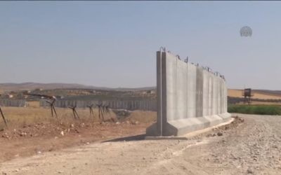 Security barrier being built on Turkey-Syria border in 2015. (Screen capture: YouTube)