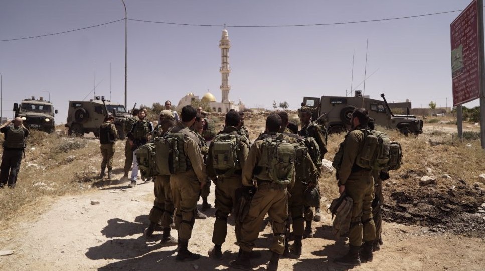 IDF soldiers stand outside the West Bank village of Yatta, near Hebron, on August 3, 2017. (IDF Spokesperson's Unit)
