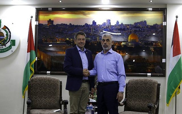 The president of the International Committee of the Red Cross, Peter Maurer left, shakes hands with Hamas chief in Gaza Yahya Sinwar following a meeting in Gaza City, September 5, 2017. (AFP/MOHAMMED ABED)