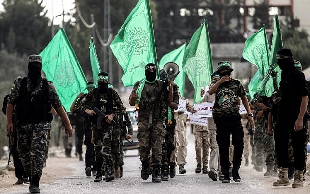 Masked youth cadets from the Ezzedine al-Qassam Brigades, the armed wing of Hamas, march in the southern Gaza Strip city of Khan Yunis on September 15, 2017. (AFP PHOTO / SAID KHATIB)
