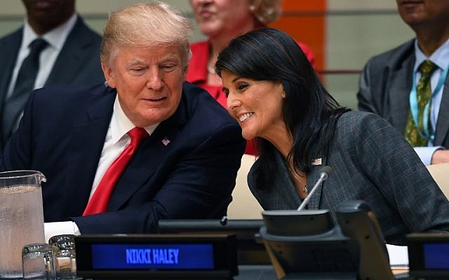 US President Donald Trump and US ambassador to the United Nations Nikki Haley speak during a meeting on United Nations Reform at the United Nations headquarters on September 18, 2017, in New York. (AFP PHOTO / TIMOTHY A. CLARY)
