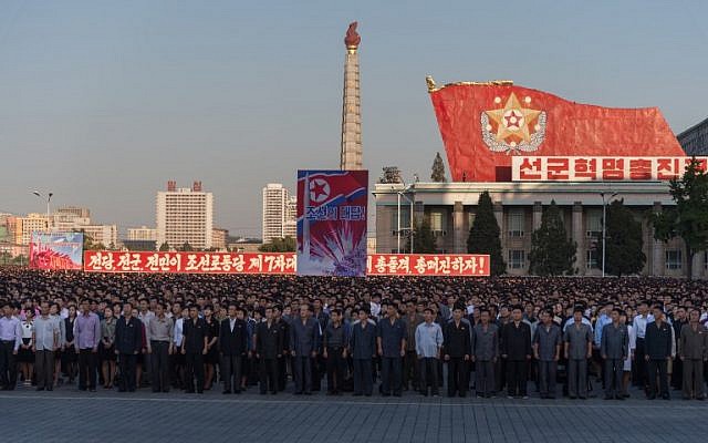 Participants in a mass rally gather in Kim Il-Sung Square in Pyongyang on September 23, 2017. (AFP PHOTO / KIM WON-JIN)