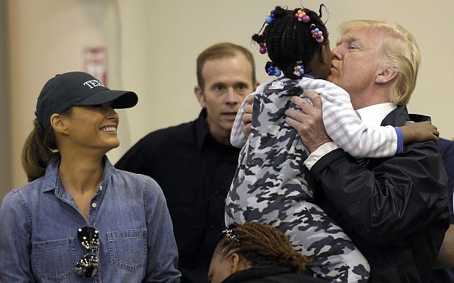 President Donald Trump and Melania Trump meet people impacted by Hurricane Harvey during a visit to the NRG Center in Houston, Saturday, Sept. 2, 2017. (AP/Susan Walsh)