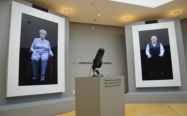 Holocaust survivors Eva Schloss, left, Anne Frank's posthumous stepsister when her mother married Frank's father, and fellow survivor Pinchas Gutter are displayed as part of an exhibit at the Museum of Jewish Heritage called 'New Dimensions in Testimony,' in New York, September 15, 2017. (AP Photo/Bebeto Matthews)