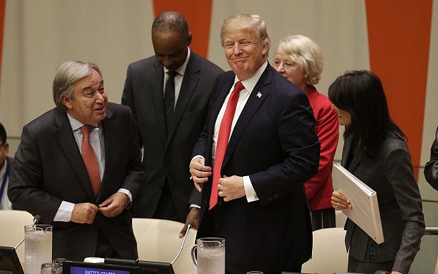 US President Donald Trump, center, gets up to leave after making a quick statement at a meeting during the United Nations General Assembly at UN headquarters, September 18, 2017. (AP Photo/Seth Wenig)